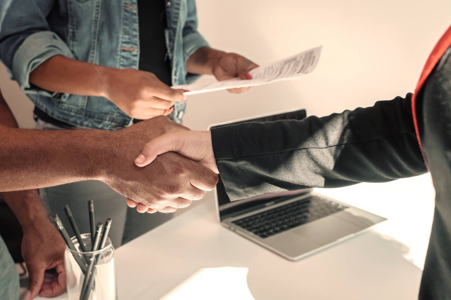 Two people shaking hands.